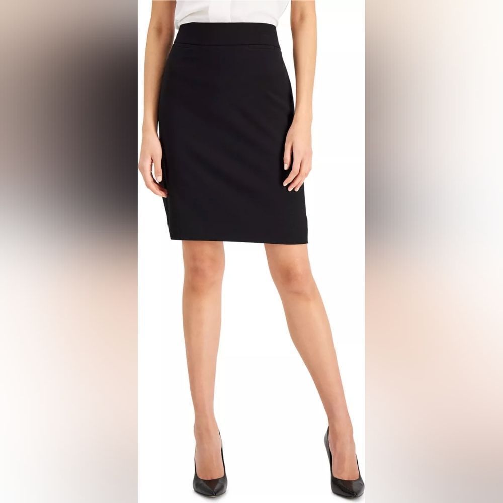 Tahari black knee length skirt in a size 4